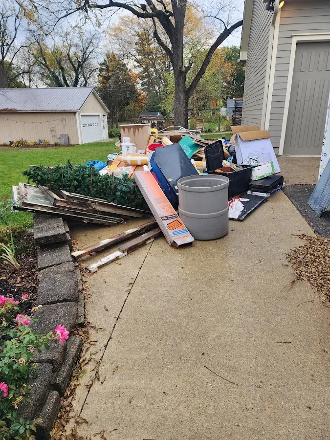 Dumpster being loaded with debris for Commercial Dumpster Rental in Florence